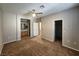 Bedroom with carpet, ceiling fan, and attached bathroom and closet at 10231 Deerfield Beach Ave # 104, Las Vegas, NV 89129