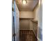 Walk-in closet with shelving, carpet, and natural light from the window at 10231 Deerfield Beach Ave # 104, Las Vegas, NV 89129