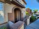 Multi-Gathering home featuring a covered entryway and gate at 10231 Deerfield Beach Ave # 104, Las Vegas, NV 89129