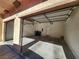 Two car garage with overhead doors, room for storage at 10231 Deerfield Beach Ave # 104, Las Vegas, NV 89129