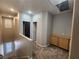 Hallway with carpet, storage, neutral paint, and views of the staircase at 10231 Deerfield Beach Ave # 104, Las Vegas, NV 89129