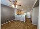 Combined dining and kitchen area with tiled floors, neutral gray wall, and modern appliances at 10231 Deerfield Beach Ave # 104, Las Vegas, NV 89129