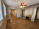 Comfortable living room with decorative fireplace and ample natural light at 10231 Deerfield Beach Ave # 104, Las Vegas, NV 89129