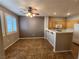 Combined dining and kitchen area with tile floors and modern appliances at 10231 Deerfield Beach Ave # 104, Las Vegas, NV 89129