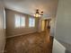 A naturally lit living room featuring tiled floors and white shuttered windows at 10231 Deerfield Beach Ave # 104, Las Vegas, NV 89129