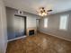 Cozy living room with a tiled fireplace and recessed media shelving at 10231 Deerfield Beach Ave # 104, Las Vegas, NV 89129
