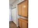 Hallway showing built in storage cabinets with a bi-fold closet, offering ample space for organization at 10231 Deerfield Beach Ave # 104, Las Vegas, NV 89129