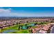 Expansive aerial shot showcases a golf course community with ponds and luxurious homes at 10305 Snyder Ave, Las Vegas, NV 89134