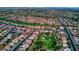 Wide aerial shot showing the density of a residential area, featuring a golf course nestled within the community at 10305 Snyder Ave, Las Vegas, NV 89134