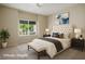 This primary bedroom has a decorative wall and a ceiling fan above a neutral carpet at 10305 Snyder Ave, Las Vegas, NV 89134