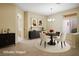 Cozy dining area with a round table, chandelier, and elegant decor at 10305 Snyder Ave, Las Vegas, NV 89134