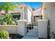 Inviting front entrance with a charming gate and desert landscaping at 10305 Snyder Ave, Las Vegas, NV 89134