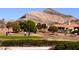View of the mountains on the golf course where people are playing golf at 10305 Snyder Ave, Las Vegas, NV 89134