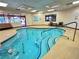 Relaxing indoor pool, complete with easy access handrails, surrounded by lounge seating and natural light at 10305 Snyder Ave, Las Vegas, NV 89134