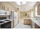 Functional kitchen with white appliances and neutral-toned cabinetry at 10305 Snyder Ave, Las Vegas, NV 89134