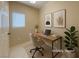 A staged home office with desk, chair, and decor in a light and airy room at 10305 Snyder Ave, Las Vegas, NV 89134
