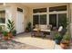 Relax on this cozy patio with comfortable seating, plants, and natural light at 10305 Snyder Ave, Las Vegas, NV 89134