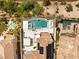 Aerial view of the backyard featuring a modern pool, spa, and outdoor living space at 11453 Glowing Sunset Ln, Las Vegas, NV 89135