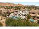 Expansive backyard with pool, spa, and outdoor kitchen, perfect for entertaining at 11453 Glowing Sunset Ln, Las Vegas, NV 89135