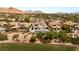 Home aerial view showcasing the pool and tile roof in a beautiful desert community at 11453 Glowing Sunset Ln, Las Vegas, NV 89135