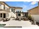 Spacious backyard with an outdoor kitchen, lounge area, and dining table at 11453 Glowing Sunset Ln, Las Vegas, NV 89135