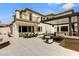 Backyard with patio, outdoor kitchen, dining, and lounge area at 11453 Glowing Sunset Ln, Las Vegas, NV 89135