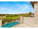 Picturesque balcony with views of a golf course and a luxury swimming pool below at 11453 Glowing Sunset Ln, Las Vegas, NV 89135