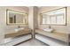 Modern bathroom with dual floating vanities, vessel sinks, and illuminated mirrors at 11453 Glowing Sunset Ln, Las Vegas, NV 89135