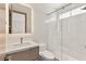 Modern bathroom featuring a glass enclosed shower and backlit mirror at 11453 Glowing Sunset Ln, Las Vegas, NV 89135