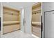 Spacious closet with custom shelving, drawers, and lighting at 11453 Glowing Sunset Ln, Las Vegas, NV 89135