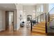 Stunning entryway with high ceilings, a curved staircase, and a glimpse into the living area at 11453 Glowing Sunset Ln, Las Vegas, NV 89135