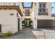 Close-up of front entry showing the front door, walkway and garage entrances at 11453 Glowing Sunset Ln, Las Vegas, NV 89135