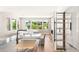 Modern kitchen with an island, ample counter space, and a seamless flow to the living area and outdoor views at 11453 Glowing Sunset Ln, Las Vegas, NV 89135
