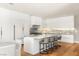 Bright, modern kitchen with a center island and bar stool seating at 11453 Glowing Sunset Ln, Las Vegas, NV 89135