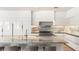 Close-up of the kitchen island and backsplash, showcasing the unique stone and modern design at 11453 Glowing Sunset Ln, Las Vegas, NV 89135