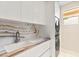 Bright laundry room with modern washer/dryer and custom countertop at 11453 Glowing Sunset Ln, Las Vegas, NV 89135