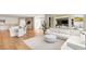 Bright open-concept living room featuring a kitchen and indoor/outdoor living with a large sectional sofa at 11453 Glowing Sunset Ln, Las Vegas, NV 89135