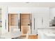 Custom kitchen pantry with shelving and drawer storage; interior lights illuminate contents at 11453 Glowing Sunset Ln, Las Vegas, NV 89135