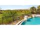 Luxury pool with water features and landscaping, overlooking the golf course and mountains at 11453 Glowing Sunset Ln, Las Vegas, NV 89135