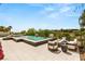 Resort-style pool and patio area with elegant outdoor furniture and desert views at 11453 Glowing Sunset Ln, Las Vegas, NV 89135