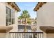 Balcony view showcasing a palm tree lined street and neighboring houses at 11453 Glowing Sunset Ln, Las Vegas, NV 89135