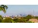 Stunning view of the Las Vegas skyline surrounded by mature trees at 11453 Glowing Sunset Ln, Las Vegas, NV 89135