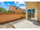 Backyard features a patio, brick wall, and a sliding glass door at 11894 Snow Bank St, Las Vegas, NV 89183