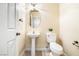Clean half-bathroom with pedestal sink and a standard toilet at 11894 Snow Bank St, Las Vegas, NV 89183
