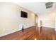 Upstairs bedroom with wood floors and mounted television at 11894 Snow Bank St, Las Vegas, NV 89183