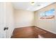 Compact bedroom features hardwood floors and natural light from the window at 11894 Snow Bank St, Las Vegas, NV 89183