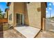 View of the home's outdoor concrete patio and sliding glass doors, ready for entertainment at 11894 Snow Bank St, Las Vegas, NV 89183