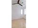 Bright bedroom featuring tile floors, two windows, and modern ceiling fan at 1319 Red Baron Ln, Boulder City, NV 89005