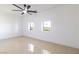 Bright bedroom with tile flooring, modern fan and picturesque windows at 1319 Red Baron Ln, Boulder City, NV 89005