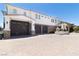 Spacious driveway leading to a three-car garage and beautifully landscaped home with ample parking at 1319 Red Baron Ln, Boulder City, NV 89005